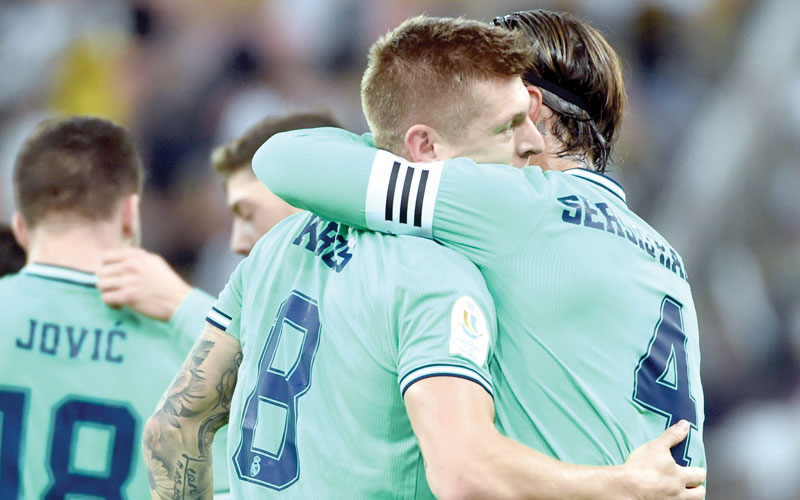 Real Madrid midfielder Toni Kroos and captain Sergio Ramos celebrate the former’s stunning striker past Valencia in the Spanish Super Cup semis in Jedda, Saudi Arabia on Wednesday. Photo/AFP