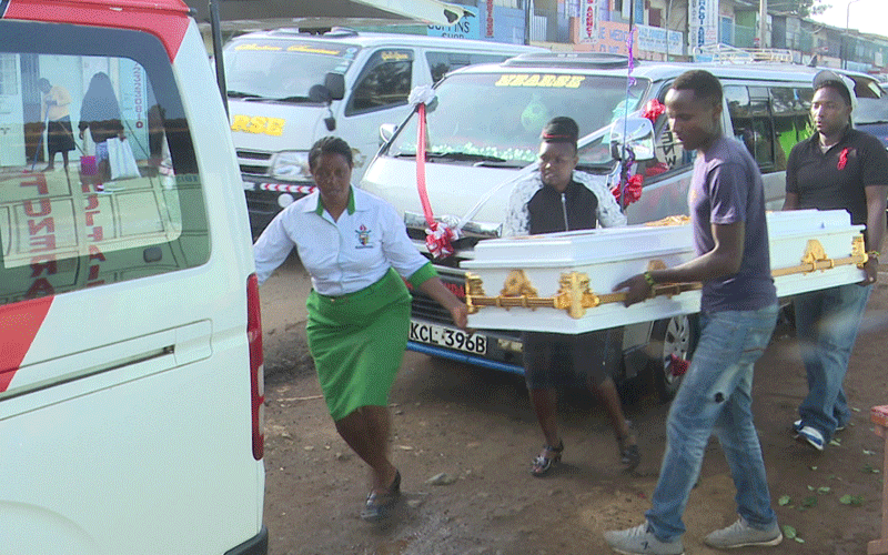 Versatile female hearse driver treading on less travelled road