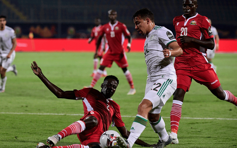 Harambee Stars defender Joseph Okumu clears the ball during Kenya’s Africa Cup of Nations match against Algeria in Egypt last year. PHOTO/Harambee Stars/Facebook