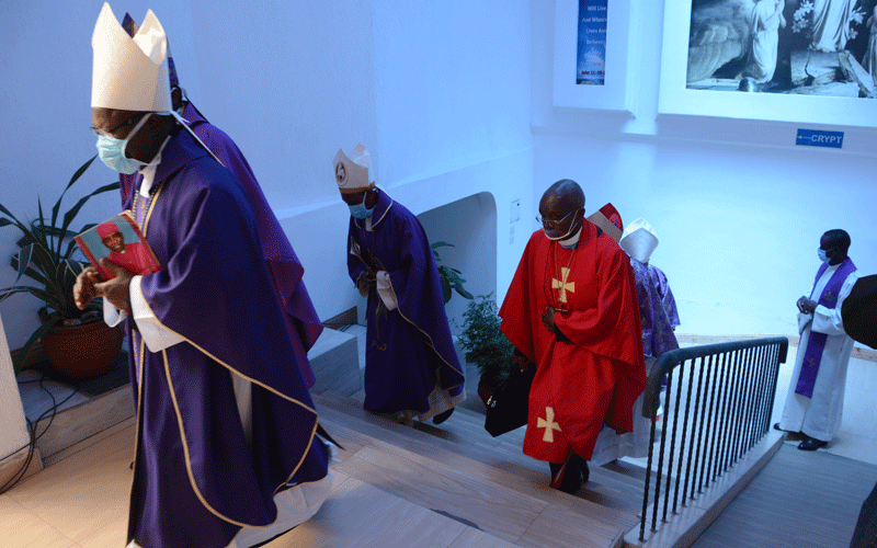 Retired Archbishop Ndingi laid to rest in low-key event