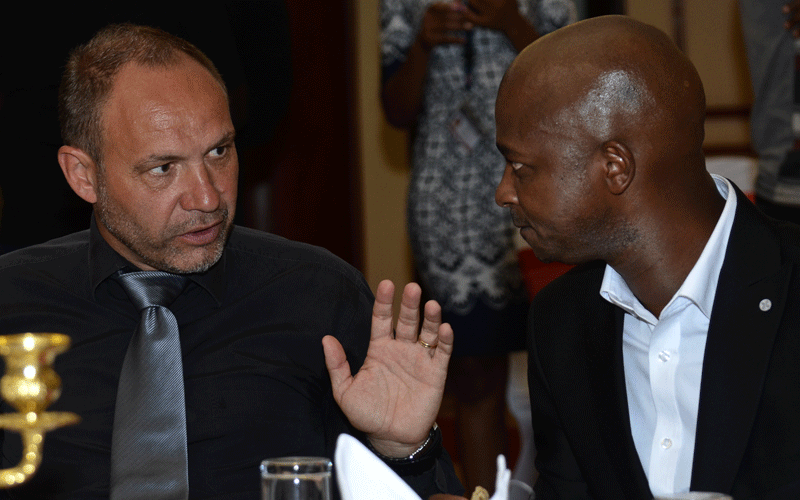 Former Harambee Stars head coach Sebastien Migne (left) and FKF boss Nick Mwendwa. PHOTO/Rodgers Ndegwa