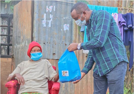 Former Dagoretti South MP Dennis Waweru distributes food and sanitizers