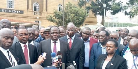 Governor chases after party leader to save career