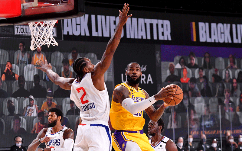 Players kneel as NBA restarts in Florida ‘bubble’