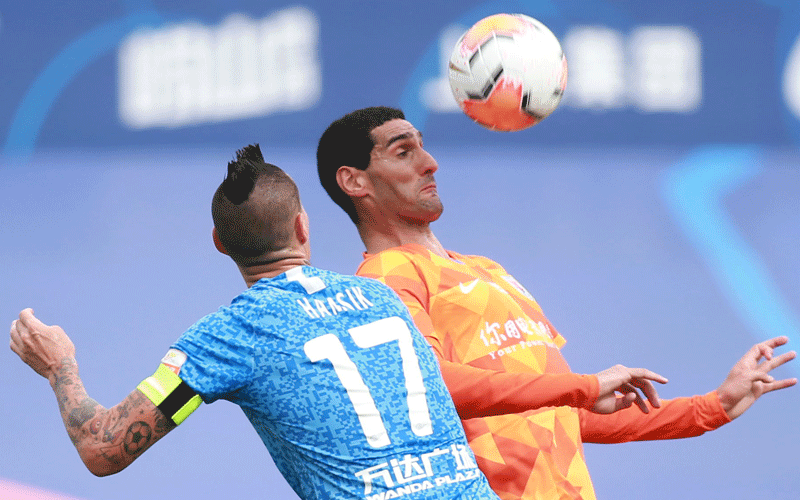 Virus victim Fellaini heads hat-trick in China