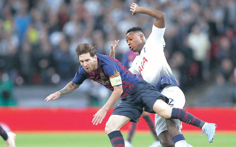 Victor Wanyama (right) tackles Barcelona’s Lionel Messi during a past UEFA Champions League match where he was deployed as a make shift central defender for Tottenham. PHOTO/ SKY Sports