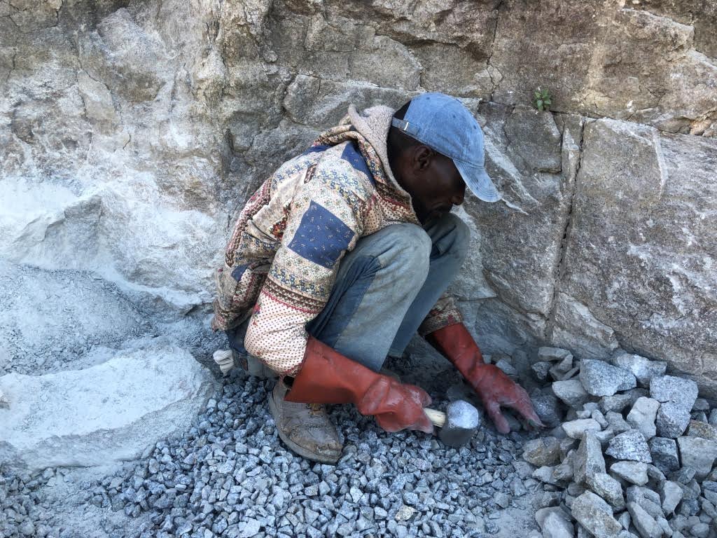 With no formal job, Zimbabwean father ekes out a living from crushing stones