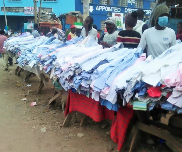 Traders wait for customers to buy second-hand clothes at an open air market in Nairobi, capital of Kenya. (Xinhua/Charles Onyango)