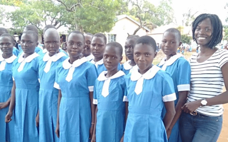 Student puts shoes on needy children’s feet