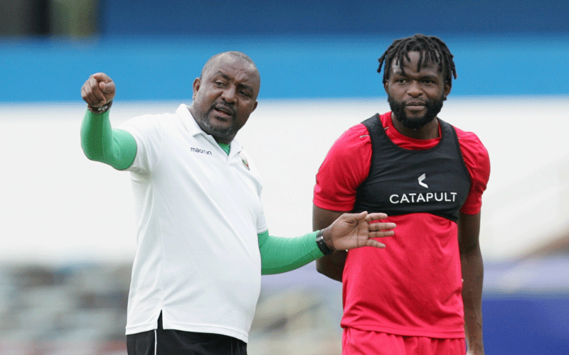 Francis Kimanzi (left) gives instructions to Johanna Omollo at a past national team training session. Omollo has been in sparkling form for Belgian League side Cercle Brudge. PHOTO/Rodgers Ndegwa