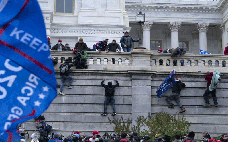 After sensing their leader Donald Trump was on the verge of exiting the White House, his supporters came in droves scaled the wall and breached barricades accessing Capitol Hill where the senate was verifying Joe Biden’s win.
PHOTO/Wire