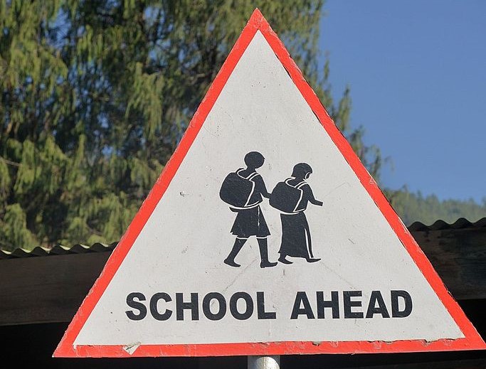 Education officer blasts politicians for confusing students, parents by sticking unnecessary posters on school signboards