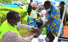 An NHIF officer takes fingerprints from a resident during a biometric registration at Bura Health Centre in Taita Taveta county PHOTO/Print