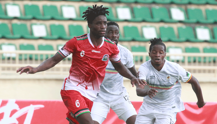 Harambee Stars midfielder Richard Odada (left) vies for the ball against Uganda Cranes’ Karisa Milton during their FIFA World Cup Qualifier at Nyayo Stadium. PHOTO/David Ndolo.