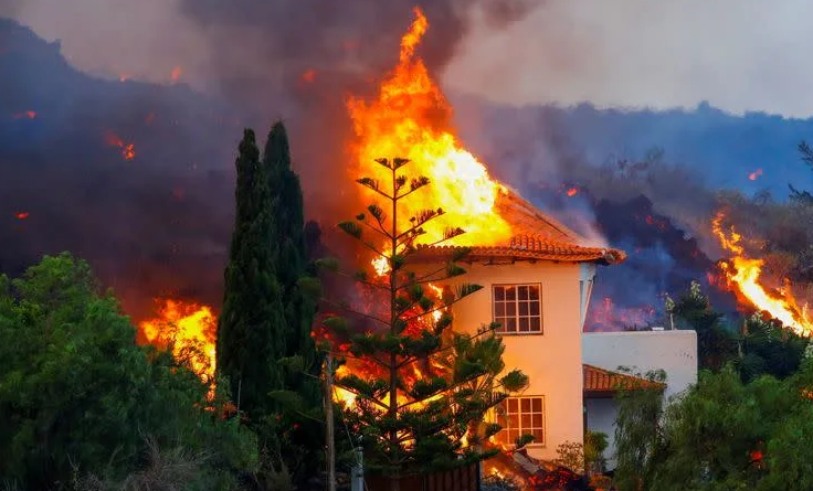 Thousands flee as volcano erupts on Spain’s La Palma island, homes destroyed