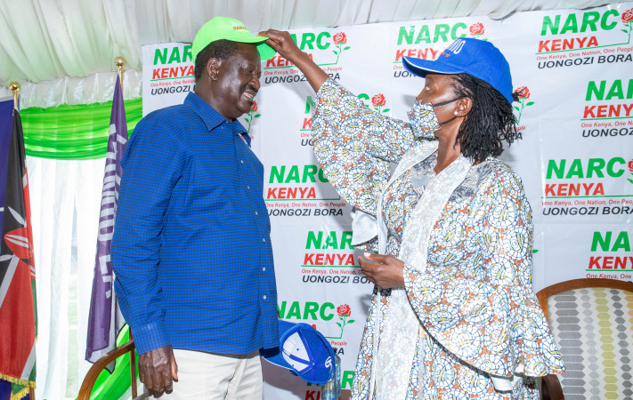 Azimio la Umoja One Kenya presidential candidate Raila Odinga welcomes Narc-Kenya party leader Martha Karua to the movement, at a Nairobi hotel. PHOTO/Kenna Claude