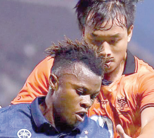 Ayub Timbe of Burriam United dribles the ball during the finals of the Chang FA Cup in Thailand. He helped the team win a treble in his first season with them. PHOTO/Ayub Timbe