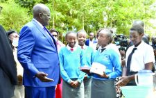 Education Cabinet Secretary George Magoha interacts with students at Mwiki Secondary School in Kasarani. PHOTO/Alex Mburu