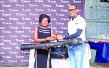 Royal Nairobi Golf Club’s Lucy Kisia receives her NCBA Golf Series Division One winner’s prize from NCBA Group Assets Finance Director Lennox Mugambi. PD/EDWIN OTIENO