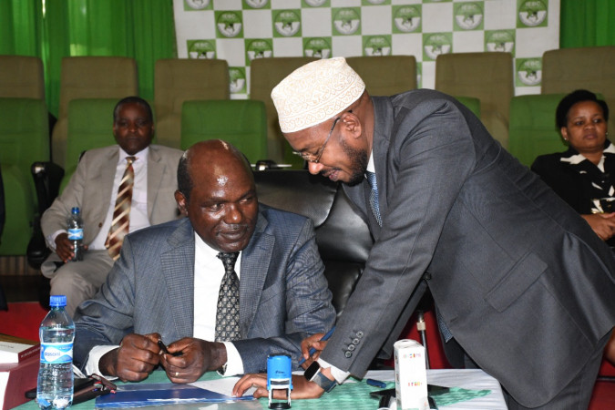 IEBC chairman Wafuka Chebukati (lef) consults with his CEO Marjan Hussein Marjan at Bomas of Kenya, recently. PD/Phillip Kamakya