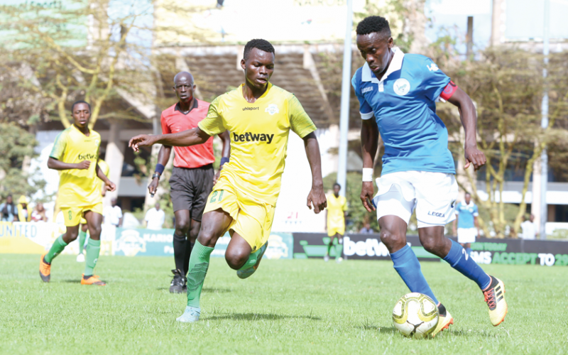Titus Achesa of Sofapaka FC (R) shields the ball from Fortune Omoto of Kariobangi Sharks during their elite pre-season cup match played at Kasarani Annex yesterday. PD/ RODGERS NDEGWA