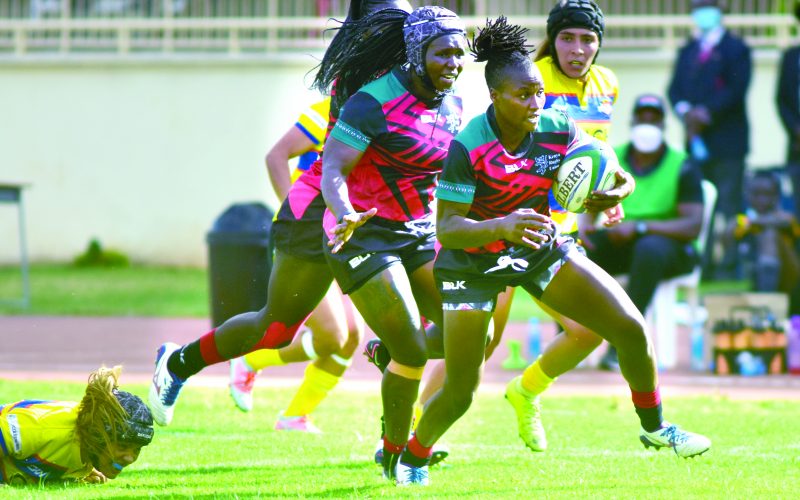 Kenya Lionesses Janet Okello (second right) with a teammate in action during a past international rugby match. PD/ALEX NJUE