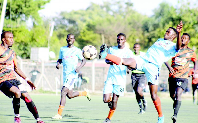 Kisumu All Stars defender Fredrick Odera (right) plays the ball past Naivas midfielder John Kelwish in a national Super League match played at Camp Toyoyo. PHOTO/David Ndolo