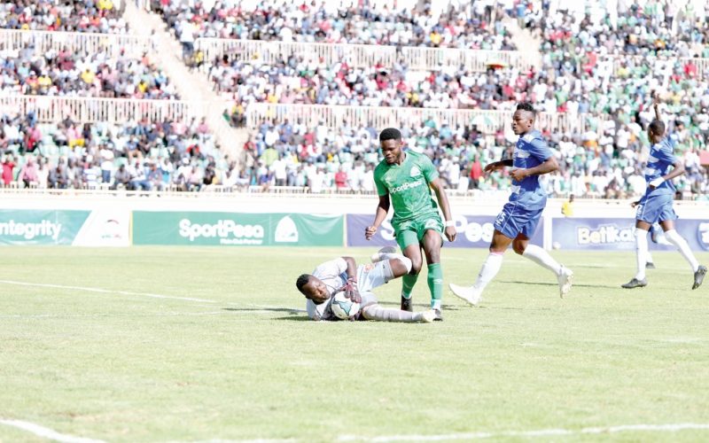 AFC Leopards custodian Levis Opiyo (left) defends the ball from Benson Omalla of Gor Mahia FC during their Mashemeji derby match played at the Nyayo National Stadium, Nairobi. PHOTO/Rodgers Ndegwa