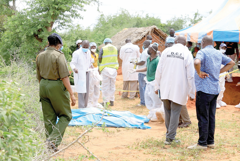 Detectives from homicide unit, DCI and other security personnel marking graves site in Shakahola to exhumed bodies. PD/RONALD MWANZOMBO