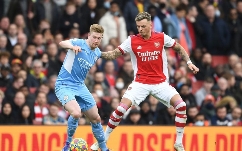 Arsenal's Ben White tussles with De Bruyne. PHOTO/Premier League
