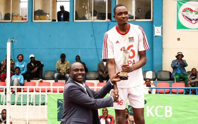 Paul Bitok Tournament Most Valuable Player receives award from Official. PHOTO/Kenya Volleyball/Facebook