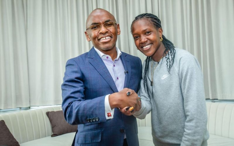 Faith Kipyegon with Safaricom CEO Peter Ndegwa. PHOTO/ @SafaricomPLC)/Safaricom/Twitter.