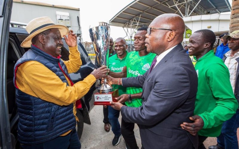 Gor Mahia chair Ambrose Rachier and Raila Odinga. PHOTO/(@OfficialGMFC)/Gor Mahia/Twitter.