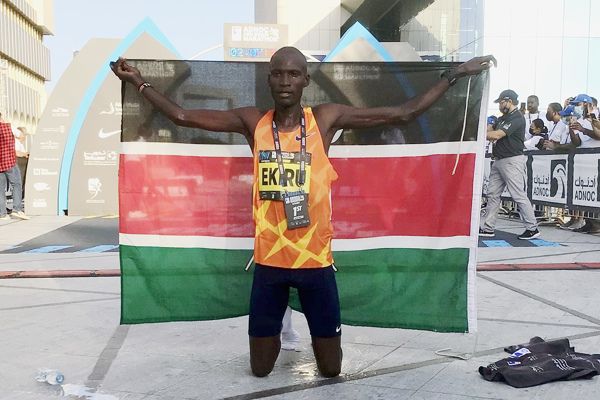 Titus Ekiru with a Kenyan flag. PHOTO/World Athletics