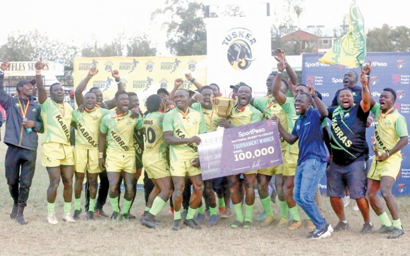 Kabras Sugar RFC players celebrate after winning the Prinsloo Sevens title at Nakuru Athletics Club on Sunday.