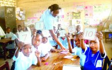 A teacher takes her pupils through a CBC lesson at Umoja Springboard Academy in Nairobi’s Umoja Estate recently.