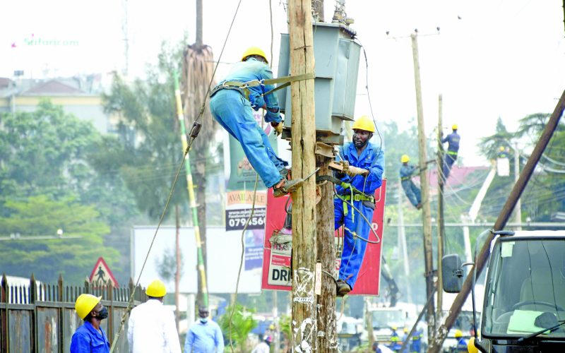 Kenya Power employees repairing a power line in the past. PHOTO/Print