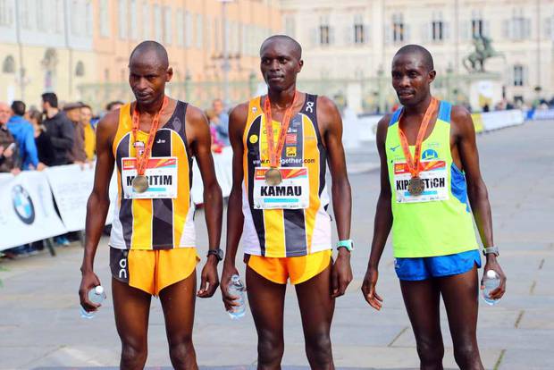 Charles Kamau centre with fellow athletes. PHOTO/Running Passsion