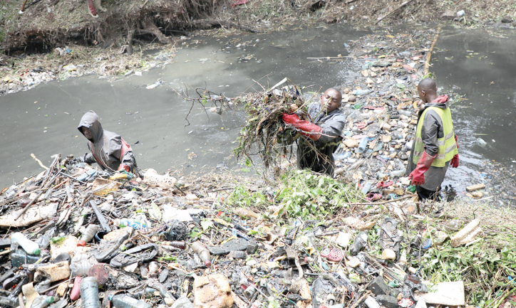 Youth clean a section of Nairobi River at Michuki Memorial Park in Nairobi on Monday in a programme funded by the government and UNEP. PHOTO/Benard Malonza