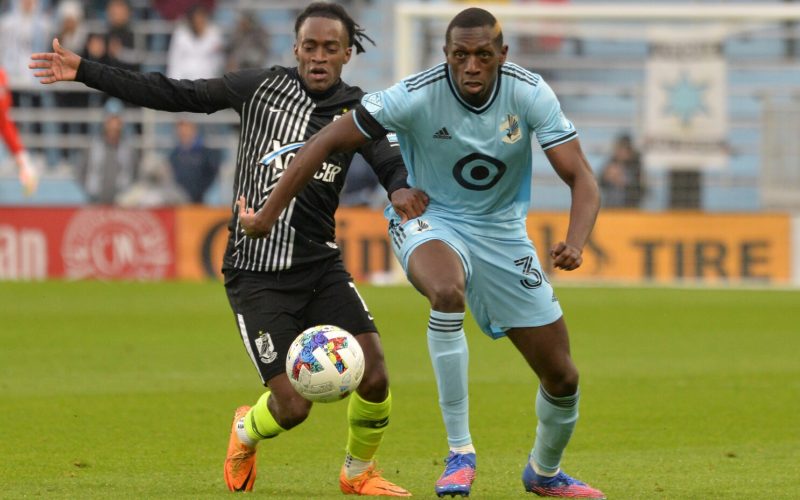 Defender Nabi Kibunguchy (36) and Union Omaha forward Noe Meza (7) chase the ball during the first half at Allianz Field. Mandatory PHOTO/Jeffrey Becker-