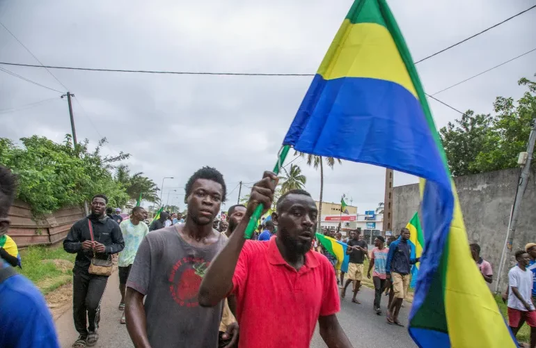 People celebrate in a street in Port-Gentil, Gabon, on August 30, 2023, in support of the military takeover. PHOTO/AL Jazeera