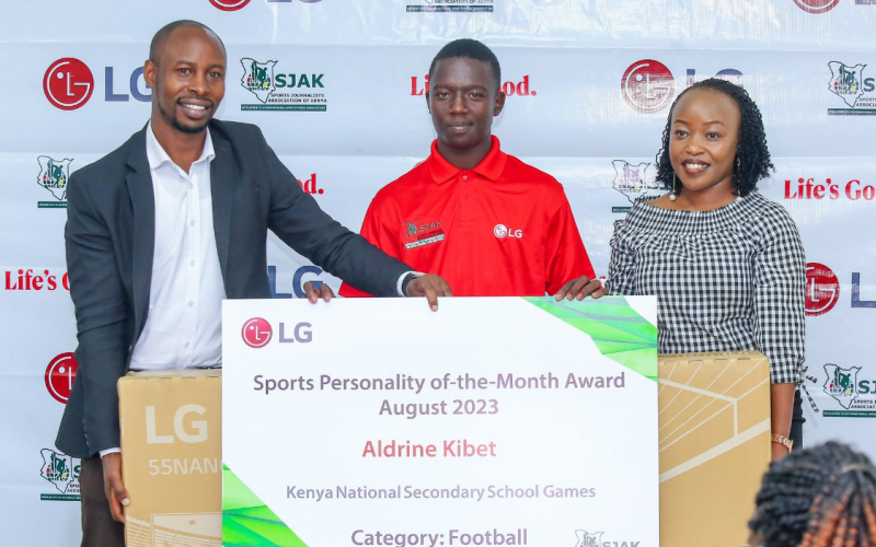 Aldrine Kibet being awarded TV set. PHOTO/SJAK