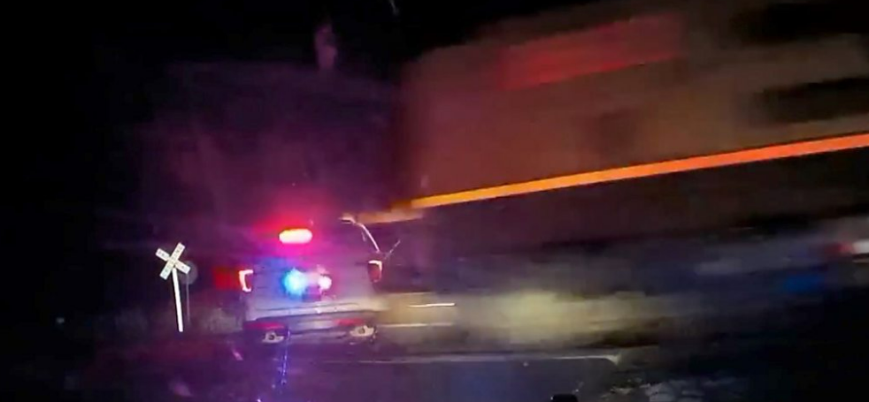 Police officer who put handcuffed woman in car that was hit by train avoids jail