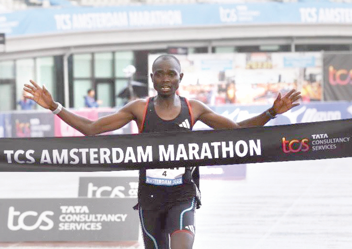 Kenya’s Joshua Belet crosses the finishing line to win this year’s Amsterdam Marathon.