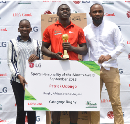 LG/SJAK Sports Personality of the Month for September Patrick Odongo receives a trophy from LG East Africa Marketing and Digital Manager Glenda Achieng (L) with SJAK Deputy President Erick Njiru at RFUEA grounds. PD/Phillip Kamakya