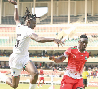 Harambee Stars defender Brian Mandela (right) vies for the ball against South Sudan attacker Ajak Chol during their friendly match played at the Kasaranni Stadium in Nairobi on September. PHOTO/Rodgers Ndegwa