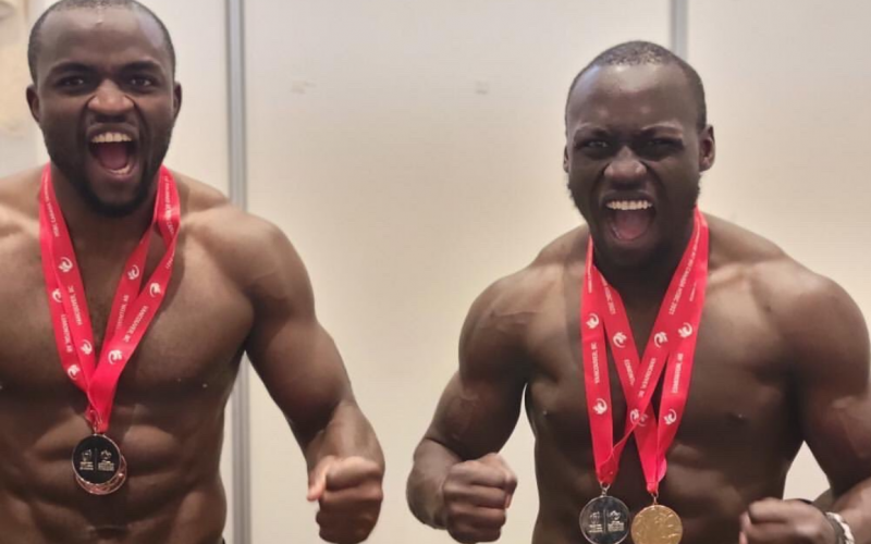 Billy Odhiambo celebrates with Willy Ambaka. PHOTO/World Rugby.