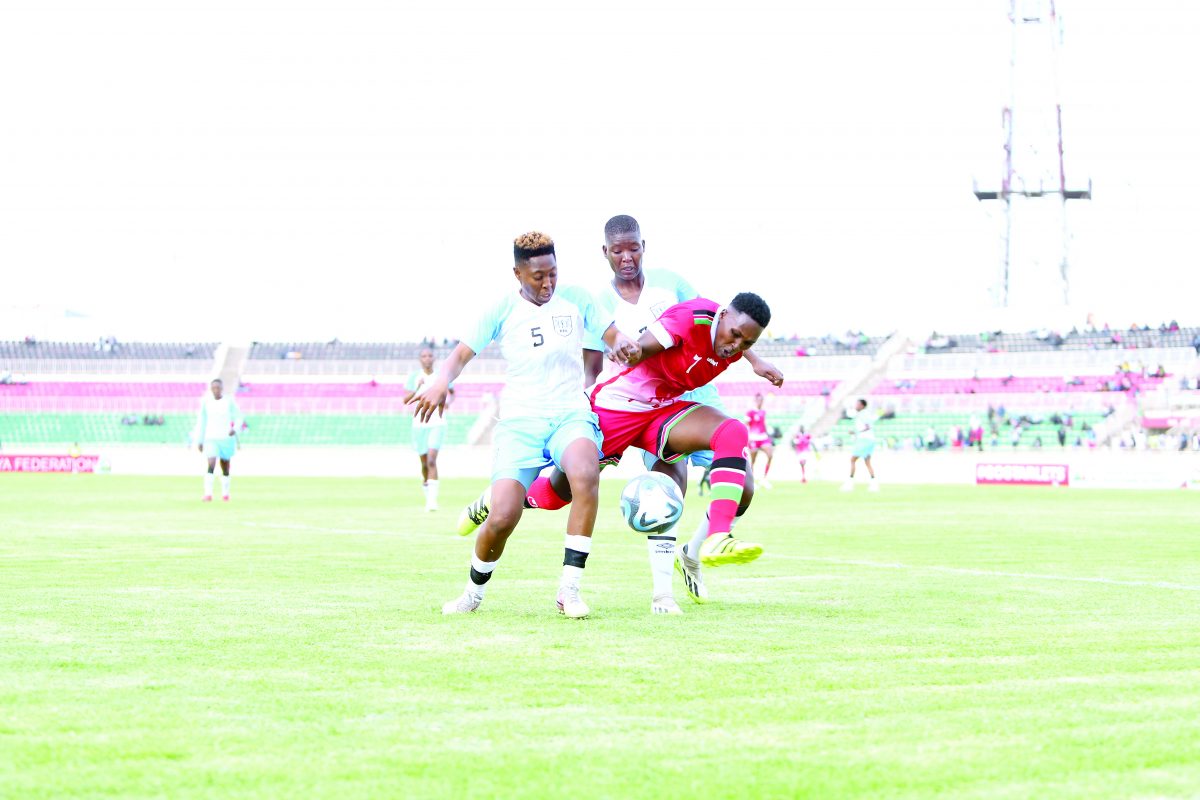 Janet Moraa of Harambee Starlets (C) is sandwitched between Leungi Senwelo and Mochawe Kesegofetse of Botswana during the first leg of their second round of 2024 Women Africa Cup of Nations qualifiers match played at the Nyayo National Stadium, Nairobi on Wednesday. PD/ RODGERS NDEGWA