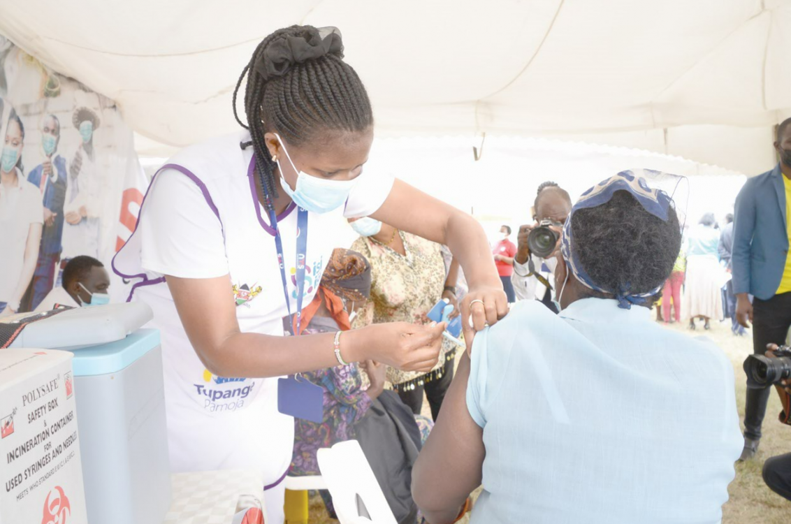 A healthcare worker administers Pfizer Covid-19 vaccine to a woman during a mass vaccination in February 2022. PHOTO/Print