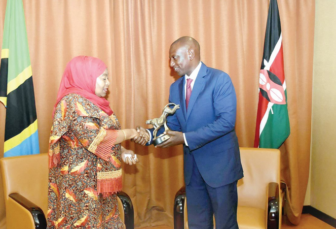 President Willliam Ruto with his Tanzanian counterpart Samia Suluhu during a past meeting in Kampala, Uganda. PHOTO/Print